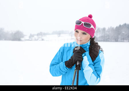 A woman cross-country skiing in the Alps Stock Photo