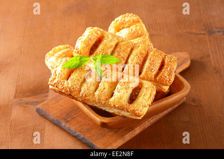 Sausage rolls topped with sesame seeds Stock Photo