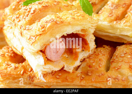 Sausage rolls topped with sesame seeds Stock Photo