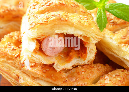 Sausage rolls topped with sesame seeds Stock Photo