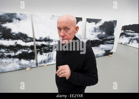 Eastbourne, UK. 13th Jan, 2015. John Virtue, the artist, at the hanging of his exhibition 'The Sea' at the Towner Gallery in Eastbourne, East Sussex, England, UK. The Exhibition opens to the public on the 17th of January 2015 and runs until April 12, 2015. Stock Photo