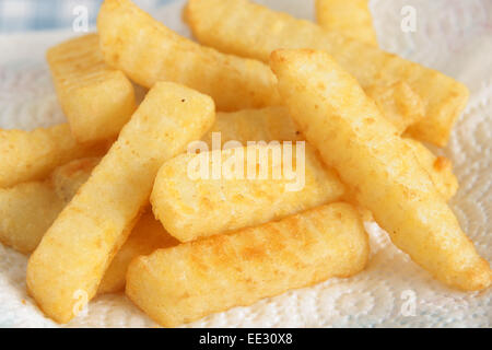 Freshly cooked crinkle cut chips or French fries Stock Photo