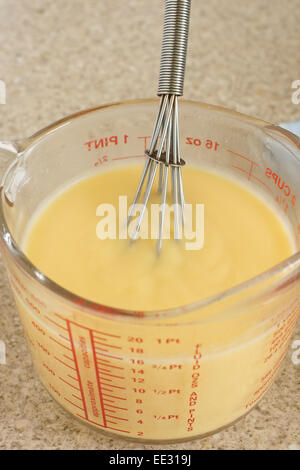 Custard a popular dessert sauce  based on a cooked mixture of milk or cream and egg yolk Stock Photo