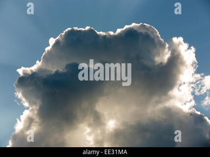 Sun rays behind dark cloud , Finland Stock Photo