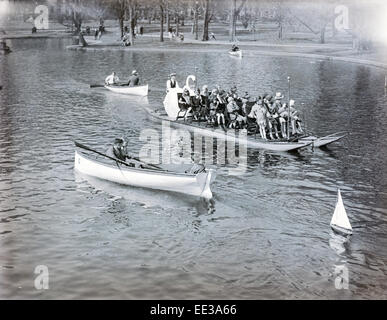 Antique 1931 photograph, swan boat and row boat in pond at Boston Public Garden in Boston, Massachusetts, USA. Image taken on April 19, 1931 also known as Patriots' Day. Stock Photo