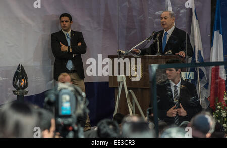 Jeruslaem, Israel. 13th Jan, 2015. Israeli Prime Minister Benjamin Netanyahu addresses a funeral ceremony for the four victims of Paris supermarket attack at Givat Shaul cemetery, on the outskirts of Jerusalem, on Jan. 13, 2015. Israeli leaders and multitude of mourners gathered Tuesday with the families of four Jewish victims of last week's terror attack on a Paris kosher supermarket for a solemn funeral ceremony at a Jerusalem cemetery. Yoav Hattab, Yohan Cohen, Philippe Braham and Francois-Michel Saada, were gunned down on Friday during a hostage attack in Paris. Credit:  Xinhua/Alamy Live  Stock Photo