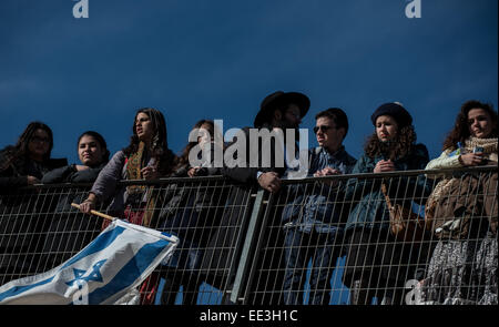 Jeruslaem, Israel. 13th Jan, 2015. People attend a funeral ceremony for the four victims of Paris supermarket attack at Givat Shaul cemetery, on the outskirts of Jerusalem, on Jan. 13, 2015. Israeli leaders and multitude of mourners gathered Tuesday with the families of four Jewish victims of last week's terror attack on a Paris kosher supermarket for a solemn funeral ceremony at a Jerusalem cemetery. Yoav Hattab, Yohan Cohen, Philippe Braham and Francois-Michel Saada, were gunned down on Friday during a hostage attack in Paris.market in eastern Paris. They were amo Credit:  Xinhua/Alamy Live  Stock Photo