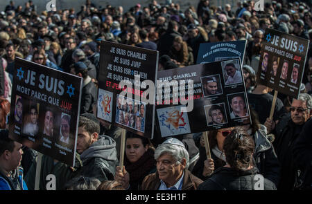 Jeruslaem, Israel. 13th Jan, 2015. People hold placards during a funeral ceremony for the four victims of Paris supermarket attack at Givat Shaul cemetery, on the outskirts of Jerusalem, on Jan. 13, 2015. Israeli leaders and multitude of mourners gathered Tuesday with the families of four Jewish victims of last week's terror attack on a Paris kosher supermarket for a solemn funeral ceremony at a Jerusalem cemetery. Yoav Hattab, Yohan Cohen, Philippe Braham and Francois-Michel Saada, were gunned down on Friday during a hostage attack in Paris.market in eastern Paris. Credit:  Xinhua/Alamy Live  Stock Photo