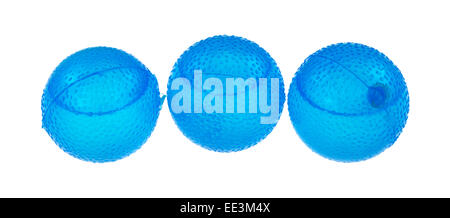Three blue filled plastic ice cubes on a white background. Stock Photo