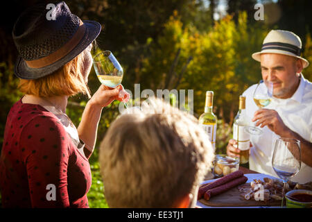 Family having a picnic in the garden, Munich, Bavaria, Germany Stock Photo