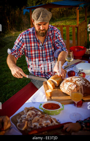 Family having a picnic in the garden, Munich, Bavaria, Germany Stock Photo