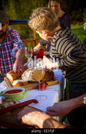 Family having a picnic in the garden, Munich, Bavaria, Germany Stock Photo