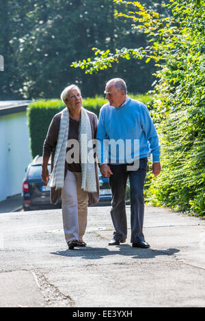 Elderly couple, both in their mid 70 taking a walk, Stock Photo