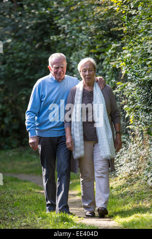 Elderly couple, both in their mid 70 taking a walk, Stock Photo