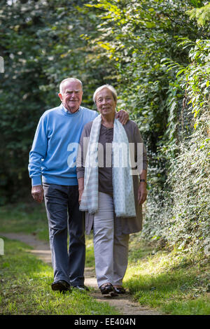 Elderly couple, both in their mid 70 taking a walk, Stock Photo