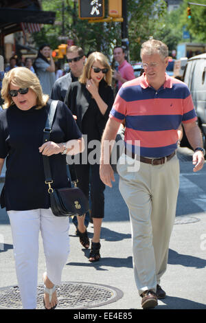 Taylor Swift spotted out in New York wearing all black carrying the Dolce & Gabbana 'Sara Handbag'  Featuring: Taylor Swift,Scott Swift,Andrea Finley,Andrea Finlay Where: Manhattan, New York, United States When: 11 Jul 2014 Stock Photo