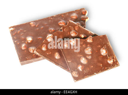 Pieces of dark chocolate with hazelnuts isolated on white background Stock Photo
