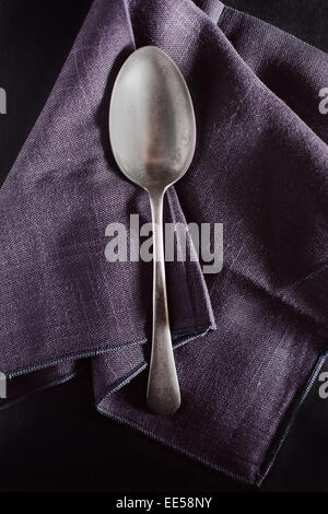 Silver spoon on napkin Stock Photo