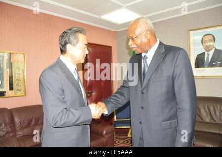 Yaounde, Cameroon. 13th Jan, 2015. Visiting Chinese Foreign Minister Wang Yi (L) shakes hands with Cameroonian Prime Minister Philemon Yang in Yaounde, Cameroon, on Jan. 13, 2015. © Huang Yanan/Xinhua/Alamy Live News Stock Photo