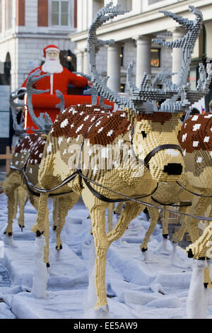 Reindeer and Father Christmas made from Lego displayed in covent Gardens london England Stock Photo