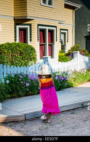 Girl in front of a house, Avonlea, Green Gables, Prince Edward Island, Canada Stock Photo