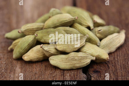 Clsoe up o some Cardamom seed on wooden surface Stock Photo