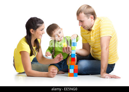 kid with his parents playing building blocks Stock Photo