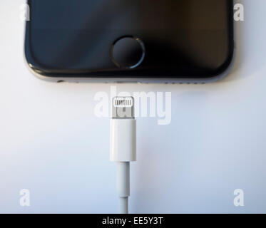 Charging cable and lightning port connector of an Apple iPhone 6 smartphone Stock Photo