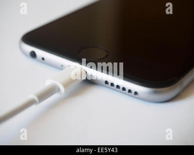 Charging cable and lightning port connector of an Apple iPhone 6 smartphone Stock Photo