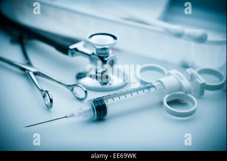 Medical instruments for ENT doctor on pale blue-green background Stock Photo