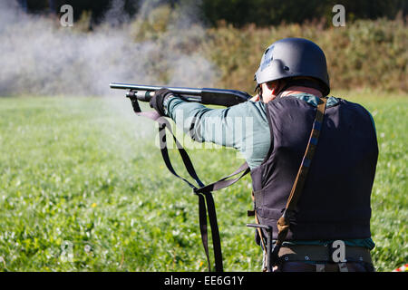Spec ops soldier shooting shotgun. Stock Photo