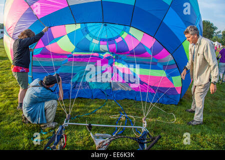 Photographer taking photos of a hot air balloon Stock Photo