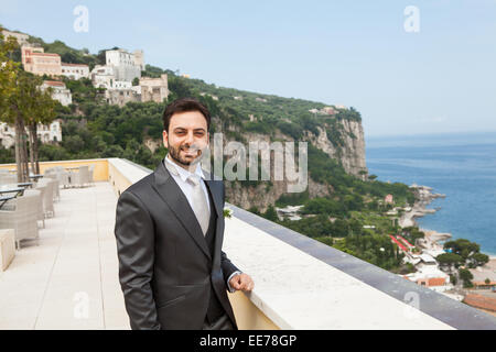 Young Italian groom with beard, brown hair and green eyes before marriage in Sorrento peninsula, Italy. Stock Photo