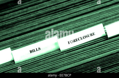 Detail of file folders for bills and foreclosure personal finances Stock Photo