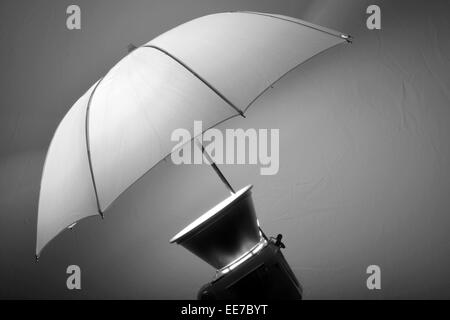 Detail of studio flash strobe light and umbrella on stand strobist professional photographer Stock Photo