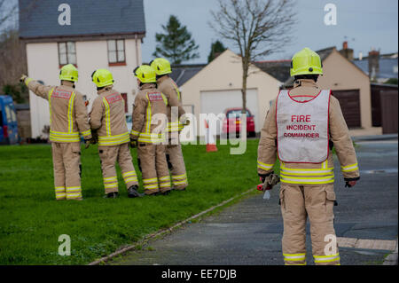 Haverfordwest, UK Wednesday 14 January 2015  Firemen attend to help make some of the roofs safe    Two people were taken to hospital after a mini-tornado struck a row of houses in Haverfordwest, Pembrokeshire Stock Photo