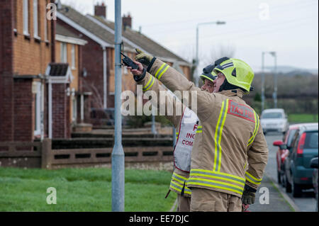 Haverfordwest, UK Wednesday 14 January 2015  Firemen attend to help make some of the roofs safe    Two people were taken to hospital after a mini-tornado struck a row of houses in Haverfordwest, Pembrokeshire Stock Photo