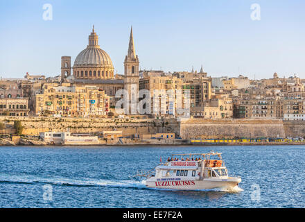 Valletta Skyline and Tourist Boat Marsamxett Harbour Valletta Malta EU Europe Stock Photo