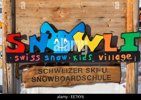 Sign for Snowli Kids Village, Swiss ski and snowboard school for children in Wallis / Valais, Switzerland Stock Photo