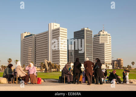 Israeli-Arab women in a family day out, sitting along the promenade in Tel Aviv, Israel Stock Photo