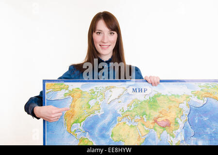 Beautiful young girl holding a map of the world Stock Photo