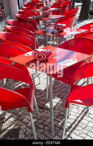 plastic tables & chairs outside a bar in Portugal