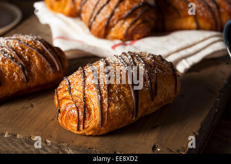 Homemade Chocolate Croissant Pastry with Powdered Sugar Stock Photo