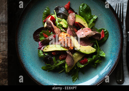 Mixed green salad with roast beef and smoked paprika aioli Stock Photo