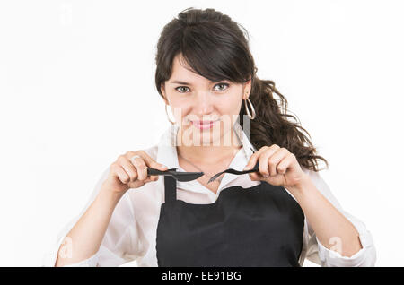 young beautiful female chef wearing black apron Stock Photo