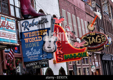 Signs for Roberts Western World, Jacks Bar-B-Que and other honky-tonks on lower Broadway in Nashville, TN. Stock Photo