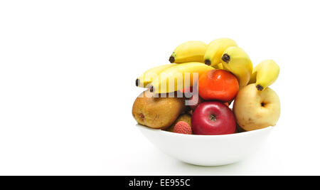 Bowl with various fruits over white background Stock Photo