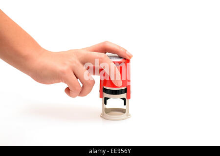 woman hand with a red stamp on white background Stock Photo