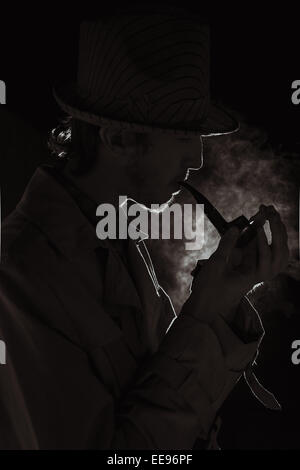 The man in style Chicago gangster with cigar on dark background Stock Photo