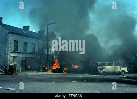 BELFAST, UNITED KINGDOM - August 1976, Burning Barricades during Troubles Riots in the Falls Road, West Belfast, 1976, Northern Ireland, Stock Photo